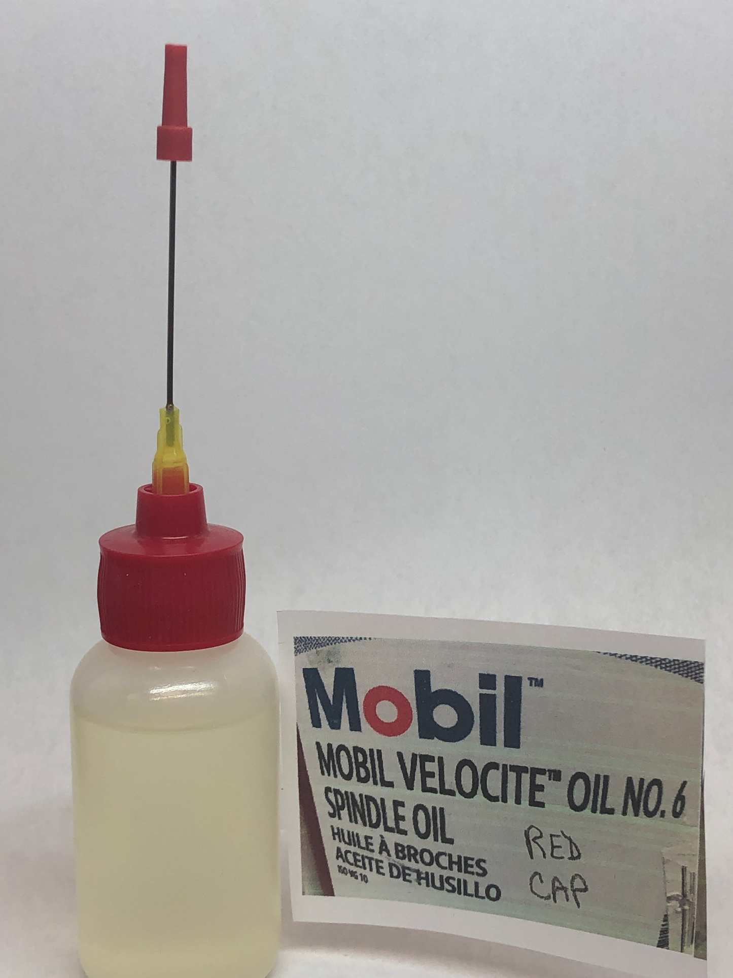 Perfect tip oiler Red Cap for black bobbins sewing machines