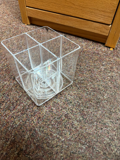 Clear spinner holds sewing tools and stick on holders