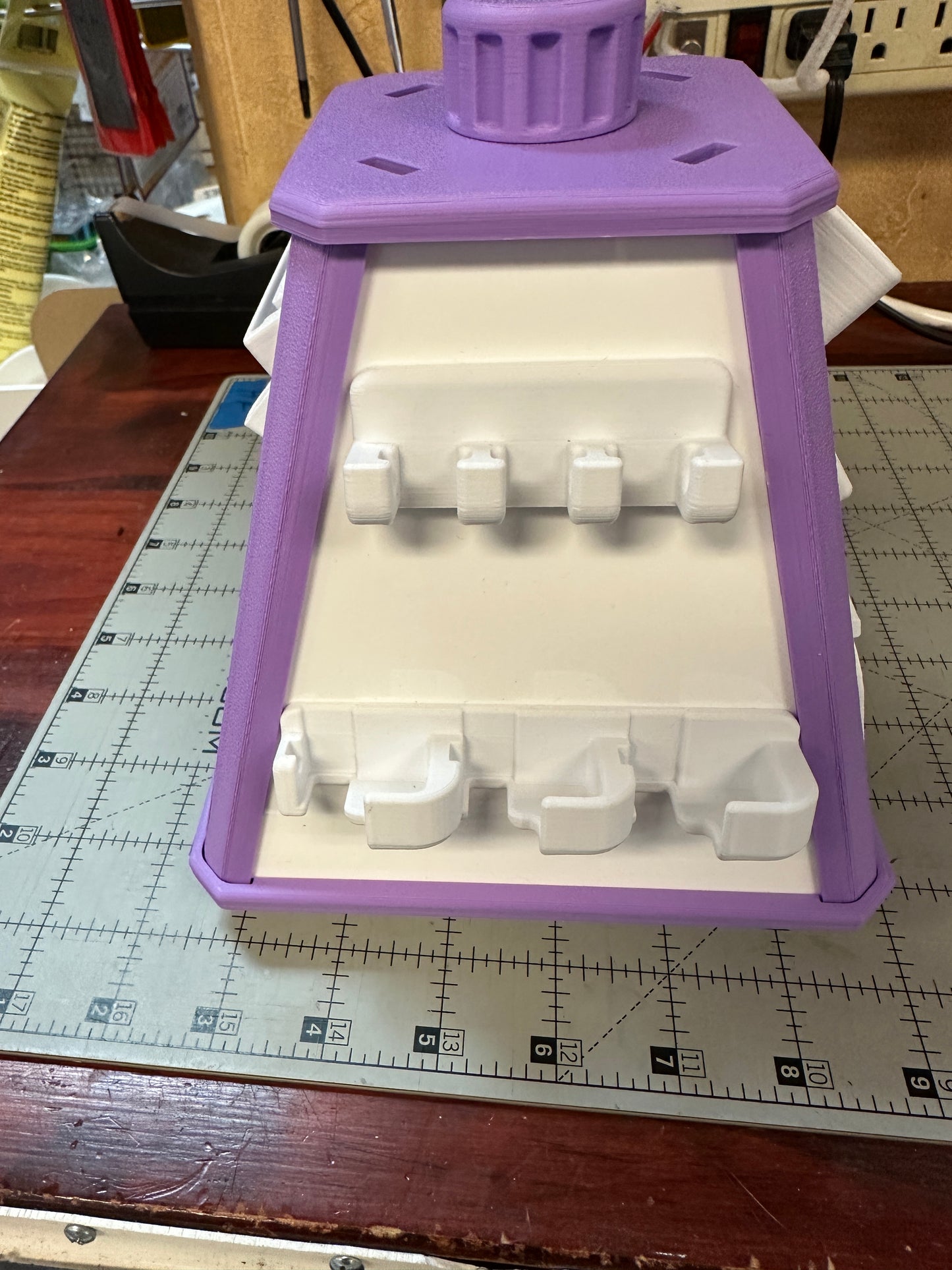 Small spinning accessory pyramid with built in holders
