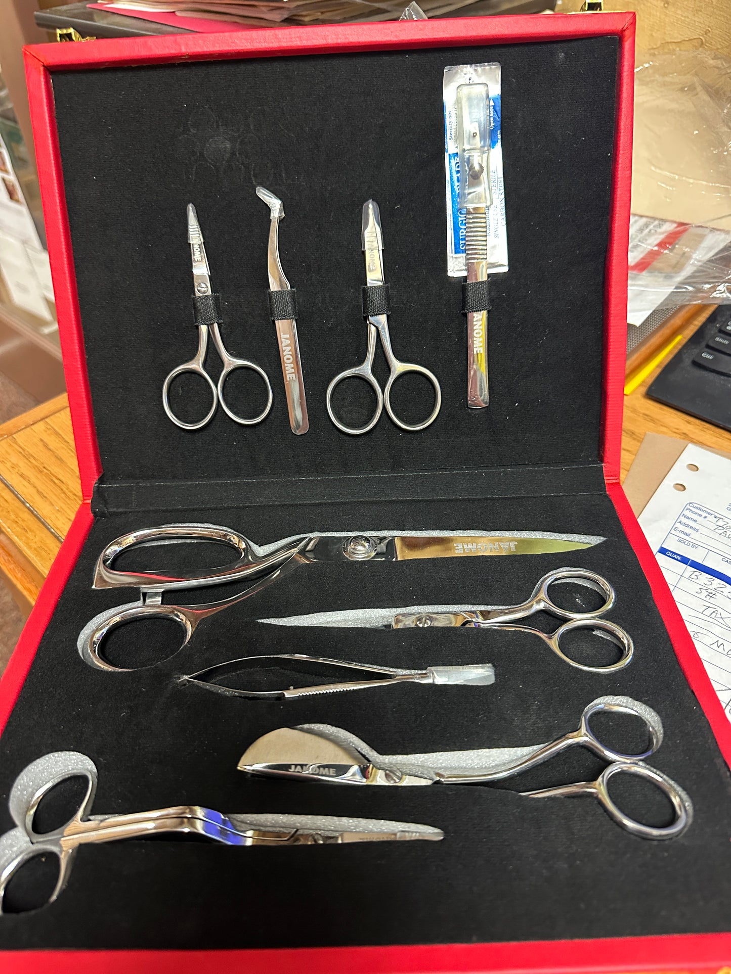 Janome Box of 7 scissors 1 tweezers 1 ripper logos