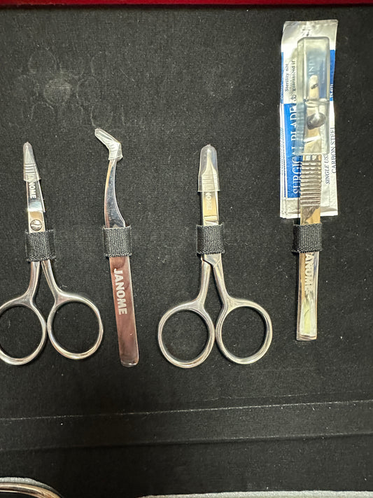 Janome Box of 7 scissors 1 tweezers 1 ripper logos