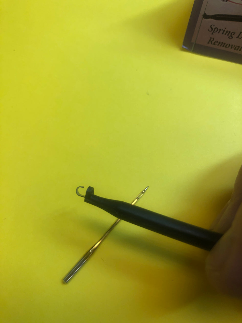 Needle Grabber with handle. Spring loaded hook to hold sewing machine