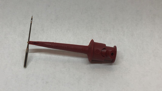 Needle Grabber holds needle to insert in sewing machine