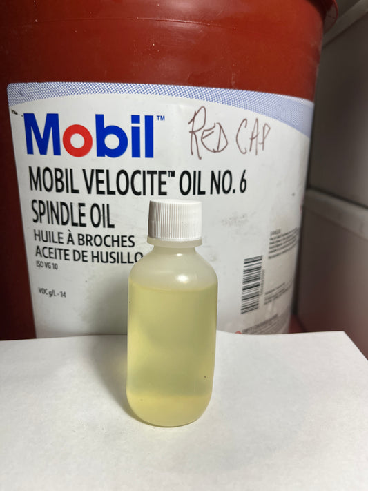 Oil refill bottle 2oz red cap for black bobbin hook area