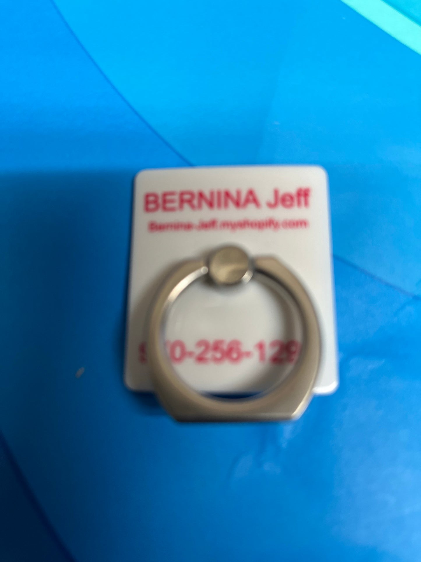 Caddy / holder for scissors or reading glasses Bernina Jeff Logo. Very strong stick-on backing.